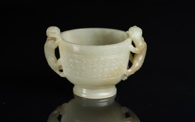 Arte Cinese A pale jade cup decorated with archaic