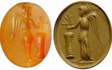 Carnelian intaglio. Winged victory, leaning a laurel branch on an...
