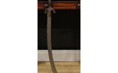 A 19th century Indian talwar, 72cm curved fullered blade wit...