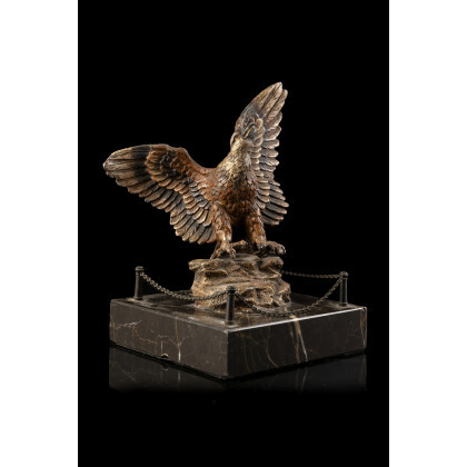 A 19th-century Viennese painted bronze alloy sculpture representing a golden eagle on marble base (h. cm 17)