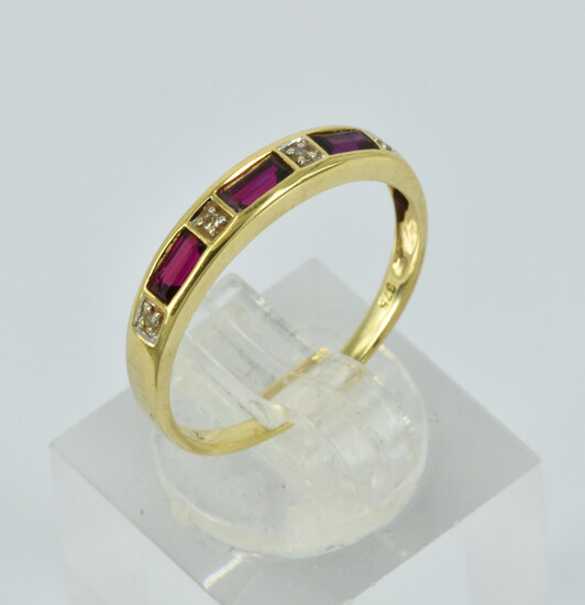 A 9CT GOLD RUBY AND DIAMOND RING