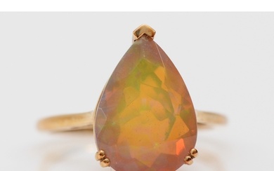 A 9ct gold and facetted pear shape opal single stone ring, 1...