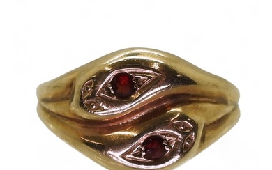 A 9ct gold snake ring the heads set with garnets, hallmarked...