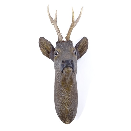 A Black Forest carved and painted wood wall-mounted deer's h...