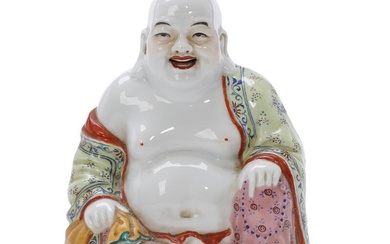 A Chinese enamelled porcelain Budai seated with a sack in his right...