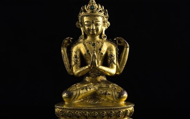 A Chinese gilt-bronze four-armed Guanyin, 18th century