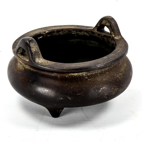 A Chinese patinated bronze incense burner, impressed seal ma...