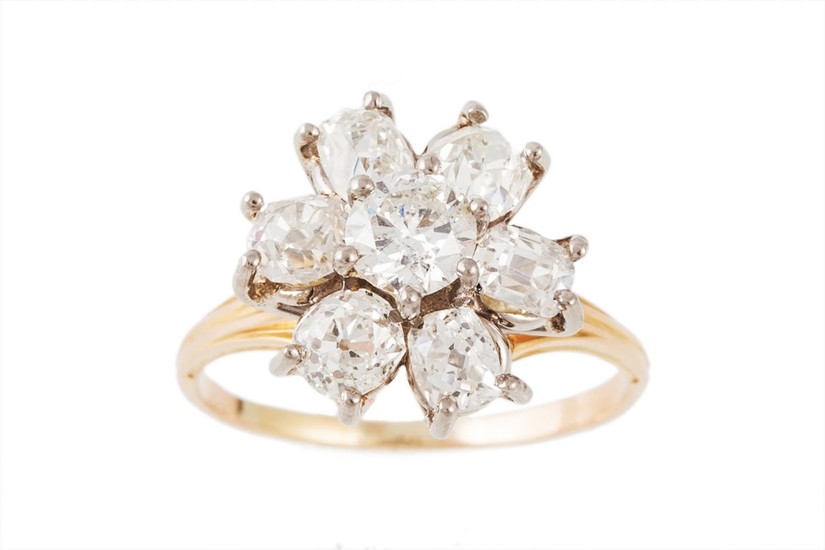 A DIAMOND CLUSTER RING, set with a brilliant cut diamond to ...