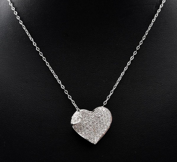 A DIAMOND PENDANT-The heart saped pendant, pave set with round brilliant cut diamonds totalling 1.40cts, attached to a fine link cha...