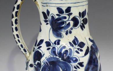 A Dutch Delft jug, late 17th/18th century, the spiralling ribbed body painted in blue with a peacock