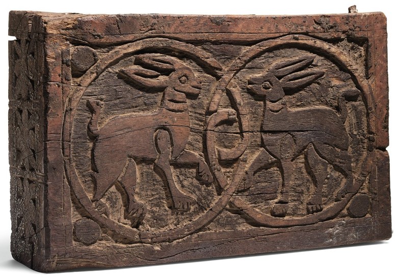 A FATIMID CARVED WOODEN PLAQUE WITH TWO HARES, EGYPT, 11TH-12TH CENTURY