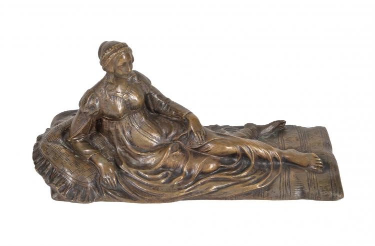 A French gilt bronze model of a reclining maiden