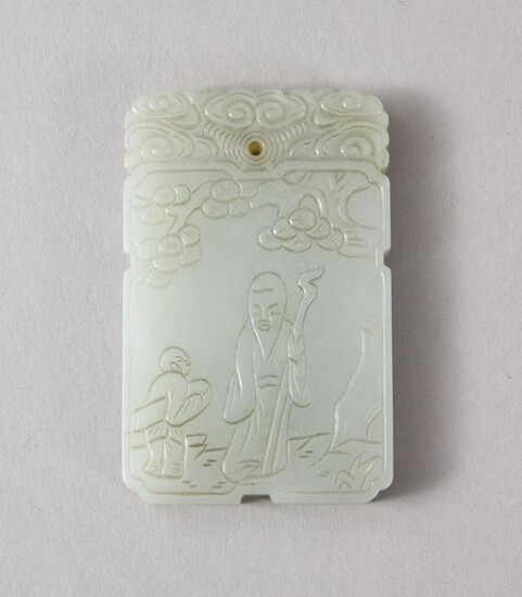 A GOOD CHINESE CARVED CELADON JADE PENDANT, carved to