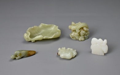 A GROUP OF CHINESE CARVED CELADON AND WHITE JADE...