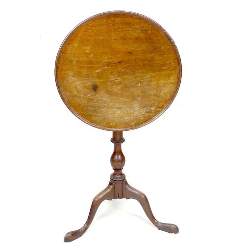 A George III mahogany occasional table, the tilt top dished ...