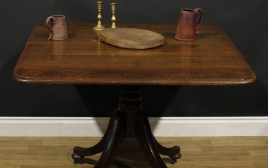 A George IV oak breakfast table, rounded rectangular tilting...