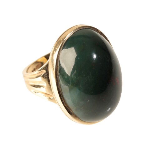 A LARGE BLOOD STONE DRESS RING the oval-cut cabochon stone, ...
