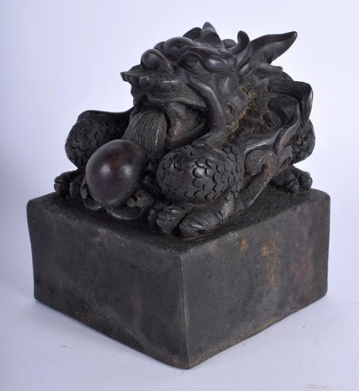 A LARGE CHINESE BRONZE SEAL, the terminal in the form