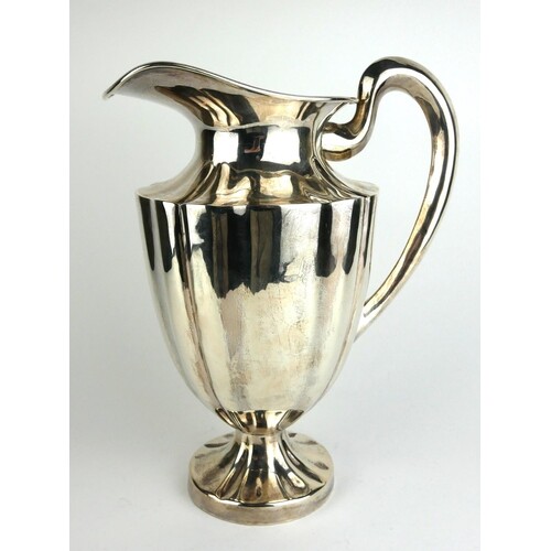 A LARGE STERLING SILVER WATER JUG Fluted design to body, mar...