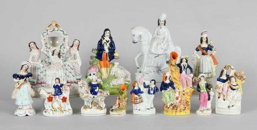 A Large Group of Staffordshire Pottery Figures