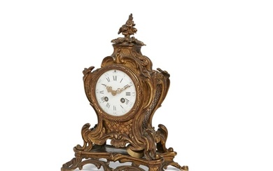 A Louis XV style bronze mantel clock