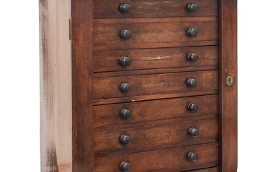 A Mahogany Collectors Cabinet Wellington Chest, late 19th Century, containing...