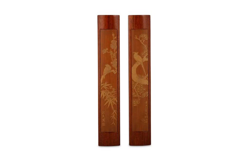 A PAIR OF CHINESE SKIN-CARVED BAMBOO SCROLL WEIGHTS.