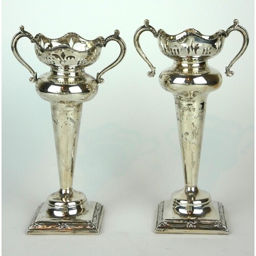 A PAIR OF EARLY 20TH CENTURY SILVER FLOWER VASES Having twin...