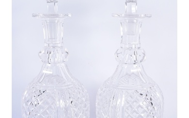 A PAIR OF REGENCY CUT GLASS DECANTERS AND STOPPERS. 28 cm hi...