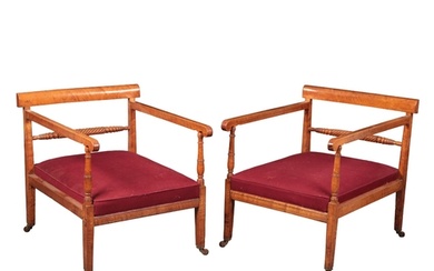 A PAIR OF SATIN BIRCH LOUNGE ARMCHAIRS early 19th century, ...