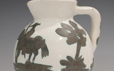 A Pablo Picasso white earthenware Bull and Picador pitcher, circa 1956, the oxidized paraffin decora