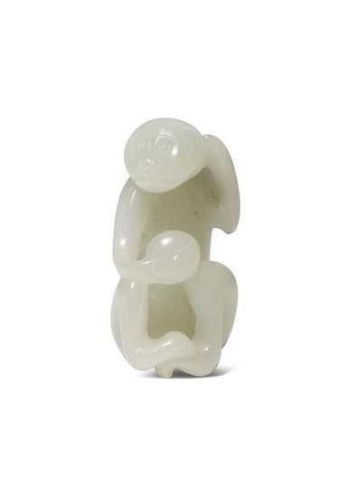 A SMALL CHINESE WHITE JADE CARVING OF A...
