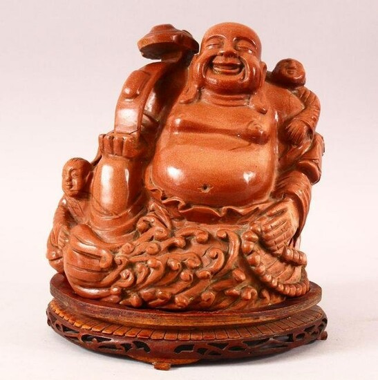 A SUPERB CHINESE HARD STONE CARVING OF BUDDHA holding a