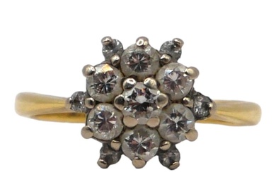 A VINTAGE 18CT GOLD AND DIAMOND CLUSTER RING The...