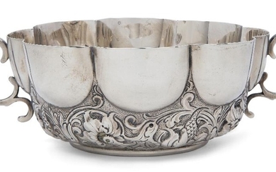 A Victorian twin-handled silver dish, London, 1894, Charles Stuart Harris, with part-lobed sides to double scroll handles and foliate scroll chased lower section, 14.5cm dia. (exc. handles), 6.3cm high, approx. weight 7.9oz Provenance: The Geoffrey...
