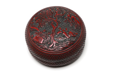 A cinnabar lacquer covered box decorated in relief with noblemen in the garden