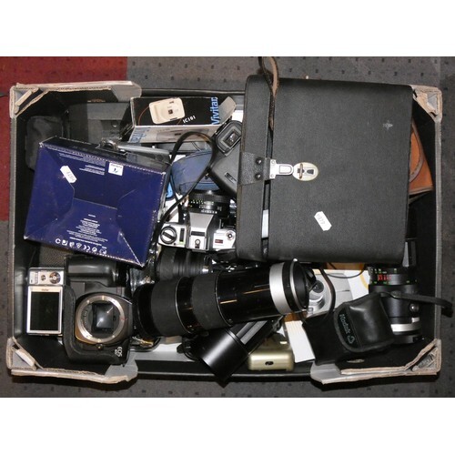 A collection of 35mm film cameras and lenses to include- Min...