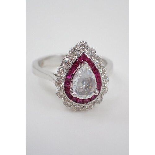 A diamond and ruby cluster ring set in 18ct gold, centre dia...