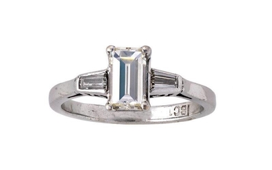 A diamond single stone ring, centring on a step-cut diamond set between tapering baguette diamond shoulders, ring size L