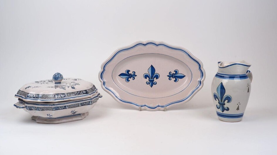A group of three French blue and white faience table wares, 19th century, to include a a lozenge shaped platter with painted fleur-de-lys decoration to the centre, with mark for Adolphe Porquier to the underside, 35.6cm long, a hexagonal twin...