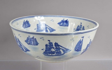 A large blue and white crackle glazed punch or fruit bowl decorated with sailing ships