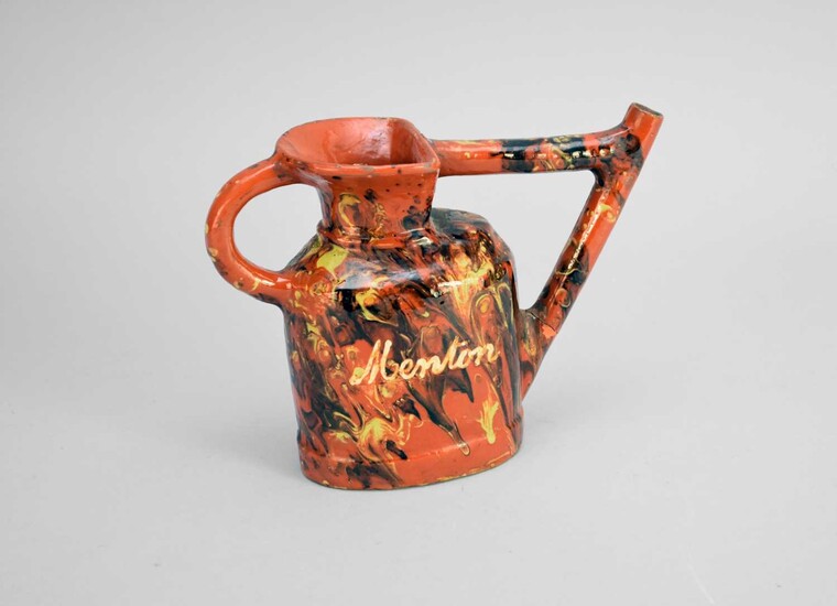 A late 19th century 'agate' ware watering can