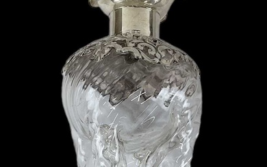 A late Victorian hallmarked silver mounted decanter, with hallmarked silver...