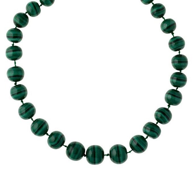 A malachite bead necklace, composed of twenty-nine graduated beads to gilt-metal clasp, length 59cm
