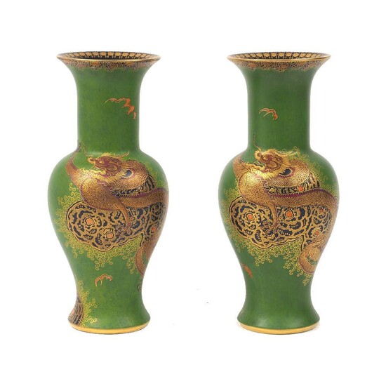 A pair of Carlton Ware baluster vases, mid to late 20th Century, of green ground decorated with 'Dragon and Cloud' pattern to the body, with black and gilt rim interior, each approximately 17.3cm high (2)