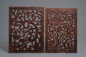 A pair of Chinese reticulated carved wooden panels…