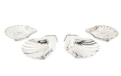 A pair of George III silver scallop shaped butter dishes,...