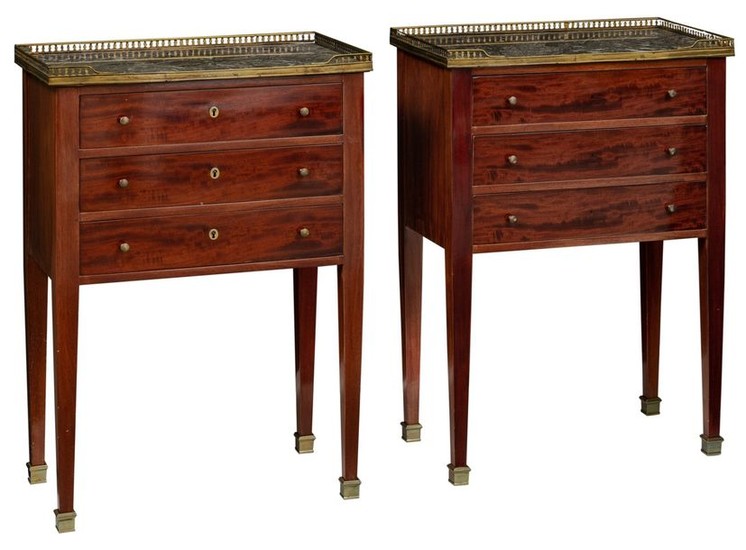 A pair of Neoclassical mahogany veneered side tables,...