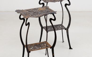 A pair of cast iron flower tables, Art Nouveau style.