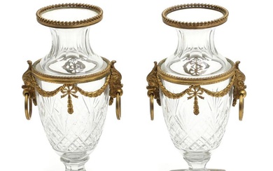 A pair of circa 1900 French crystal and gilt bronze vases. Empire...